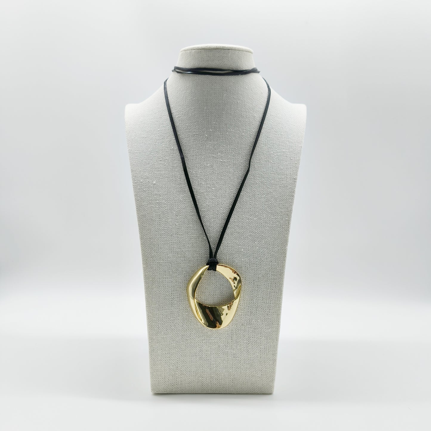 Gold Mobius Ring Necklace – Modern Pendant on Black Leather Cord