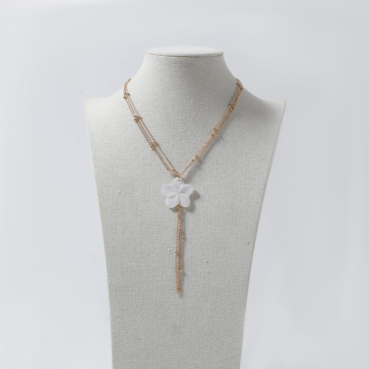 Gold Multi-Chain with White Flower Pendant & Tassel Y-Necklace