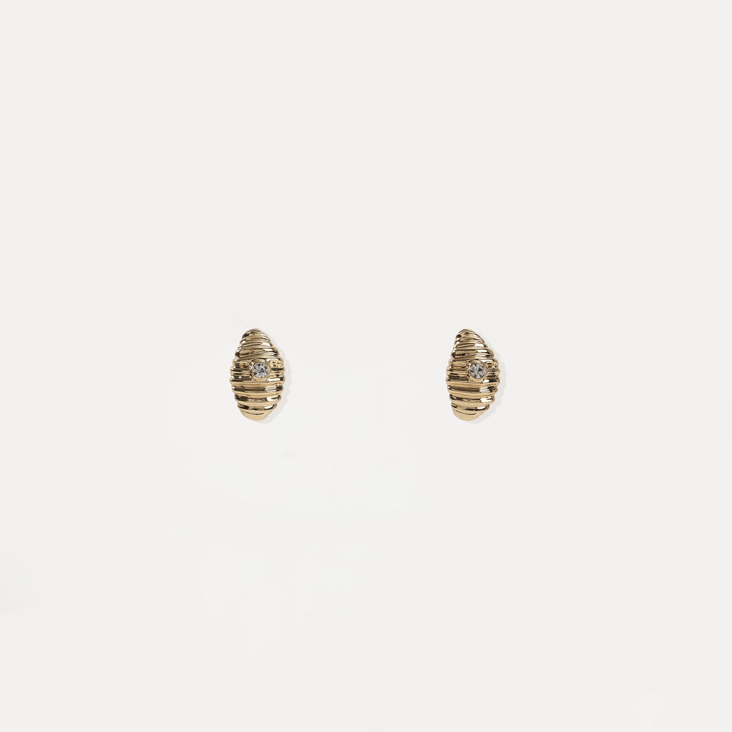 Gold ribbed oval stud earring with central crystal accent