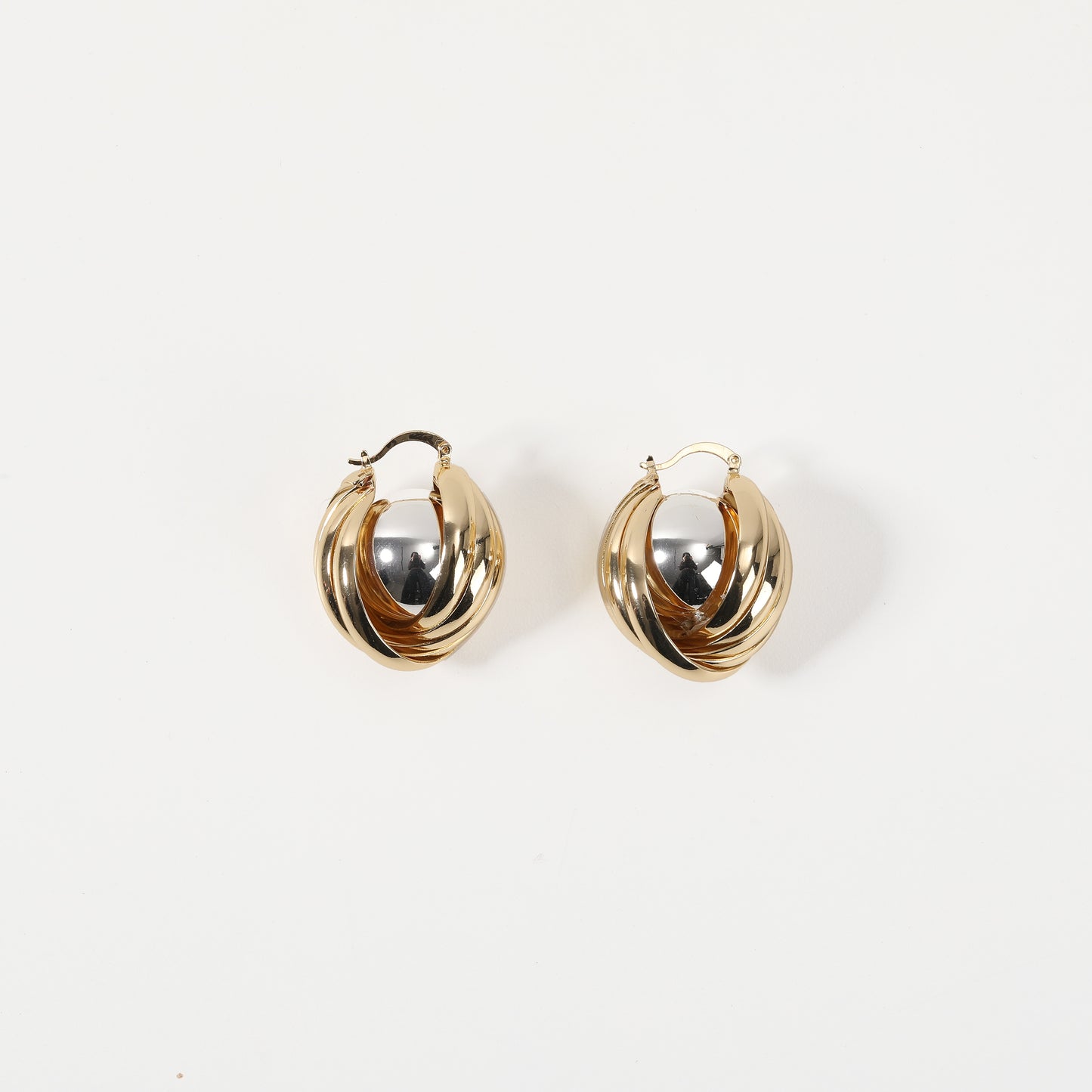 Gold twisted double hoop earring with silver accent