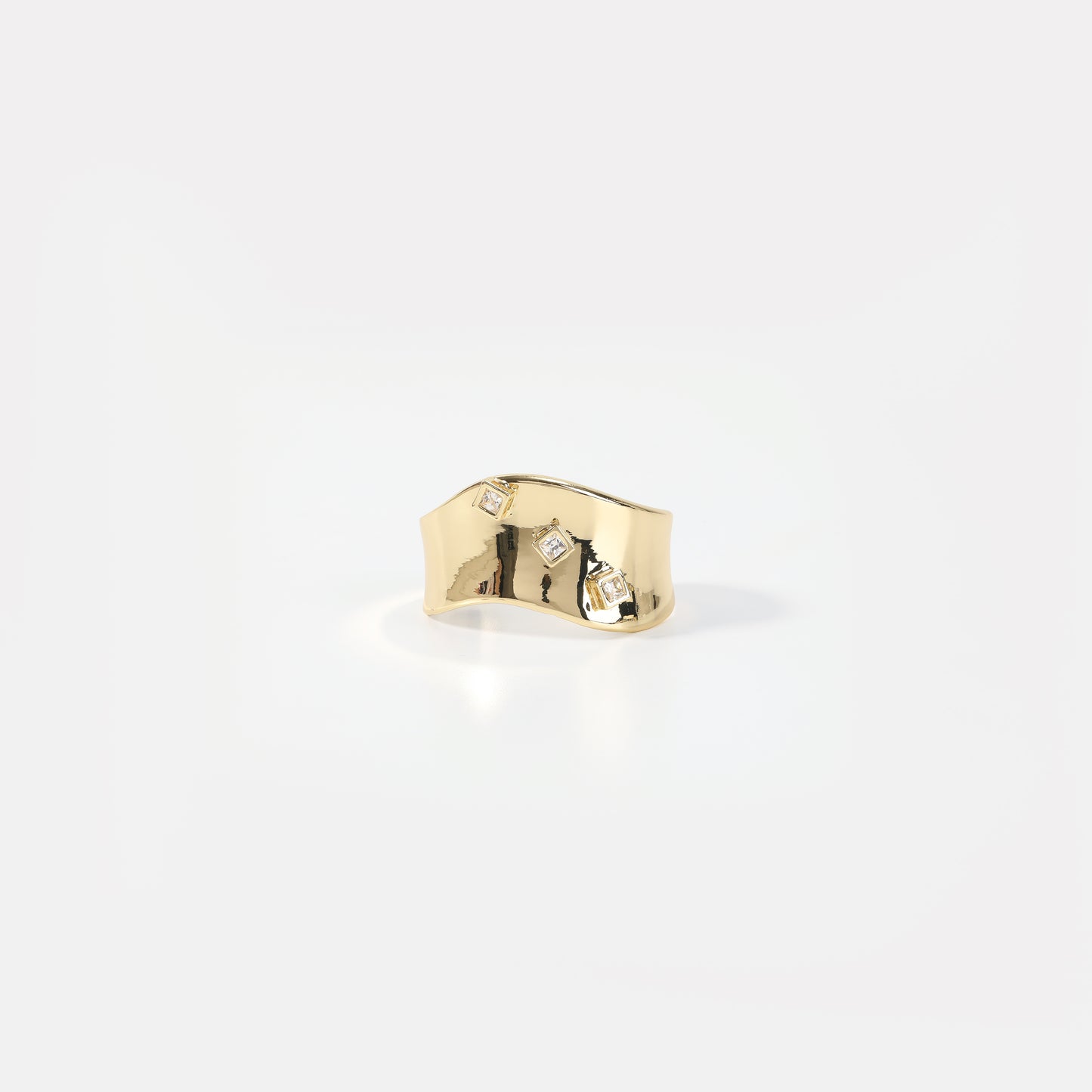 Gold wavy wide band with square crystal ring