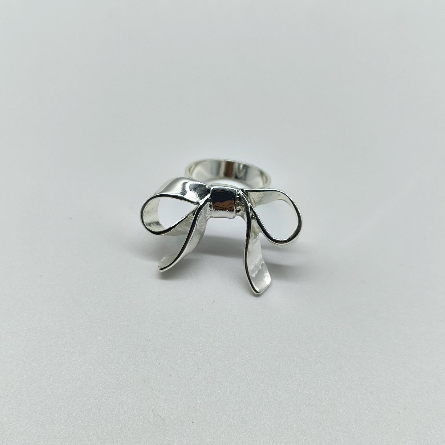 Statement Bow Ring – Shiny Silver Ribbon-Inspired Jewelry