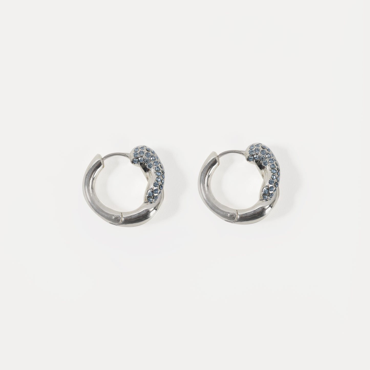 Silver chunky hoop earring with light blue crystal accent