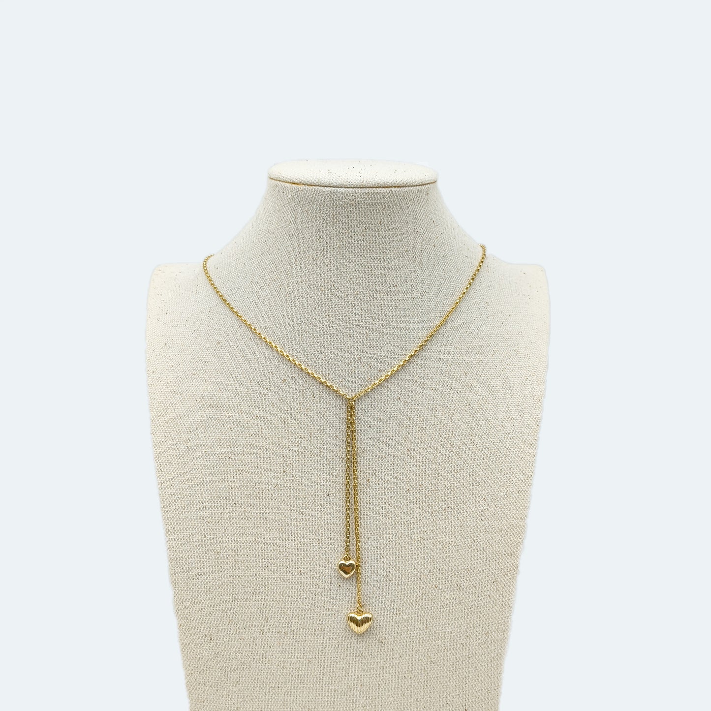 Gold lariat necklace with heart pendant