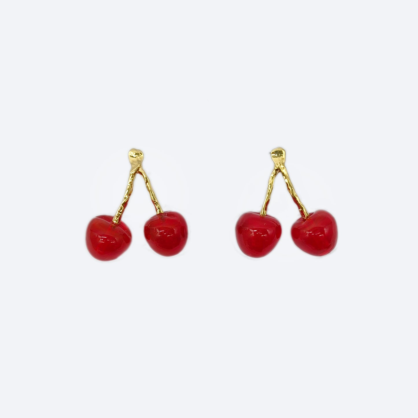 Gold plated metal with red glass cherry pendant stud earrings