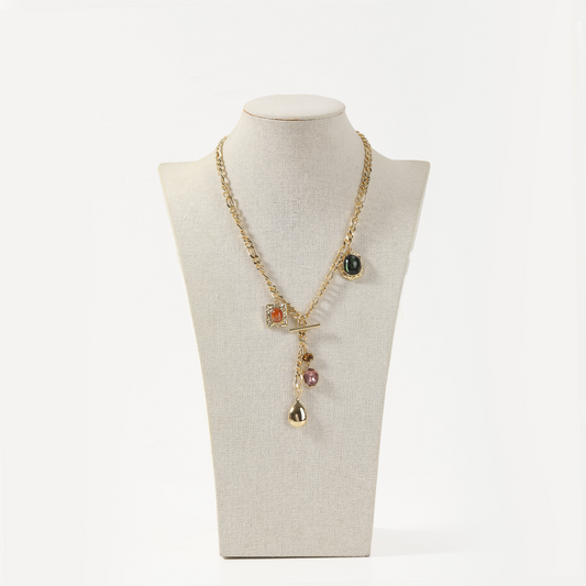 Gold curb chain necklace with mixed gemstone charms and toggle clasp