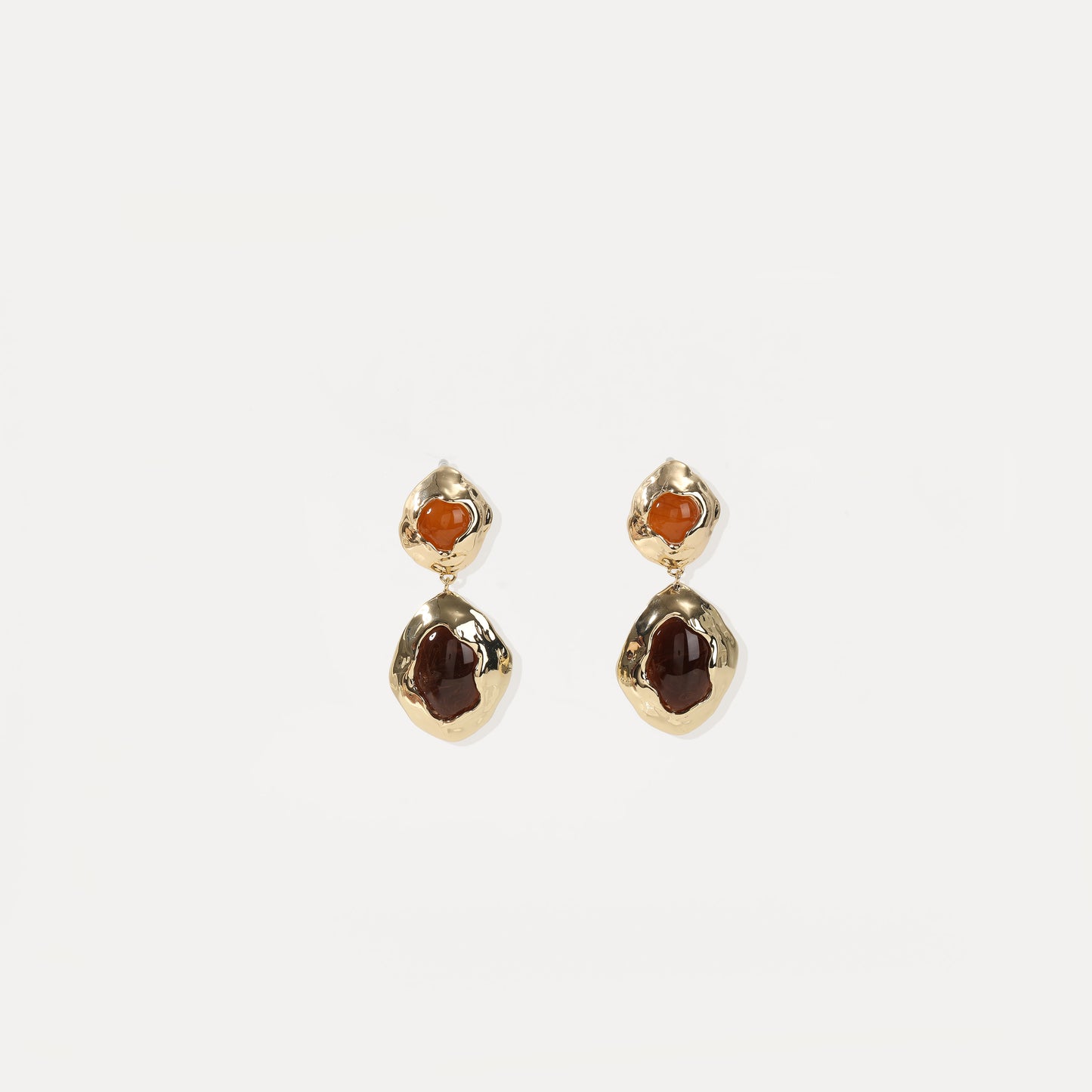Gold drop earring with two-tone amber cabochons and hammered metal frames