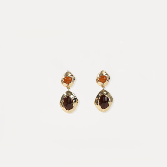 Gold drop earring with two-tone amber cabochons and hammered metal frames