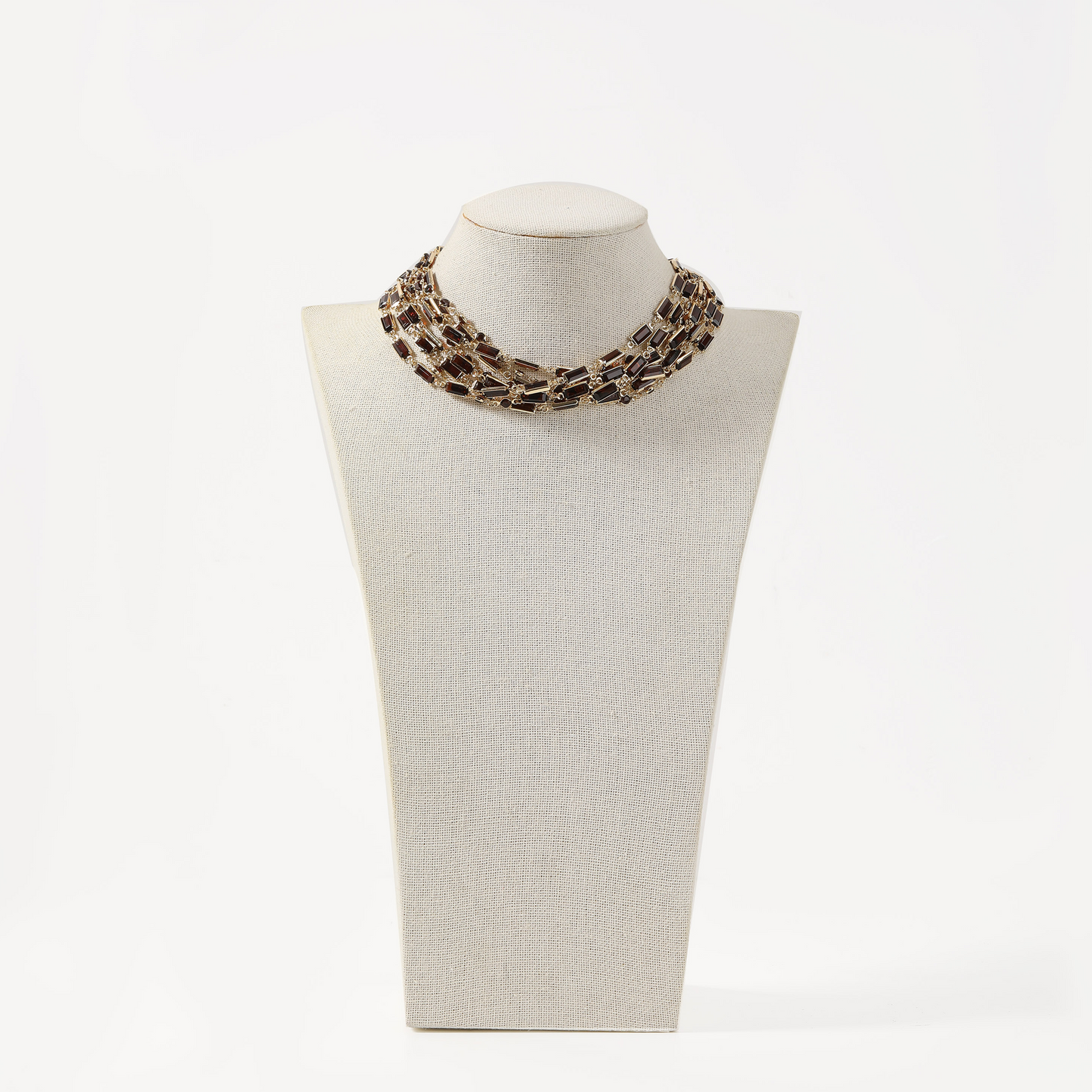 Gold multi-strand choker necklace with brown rectangular crystals.