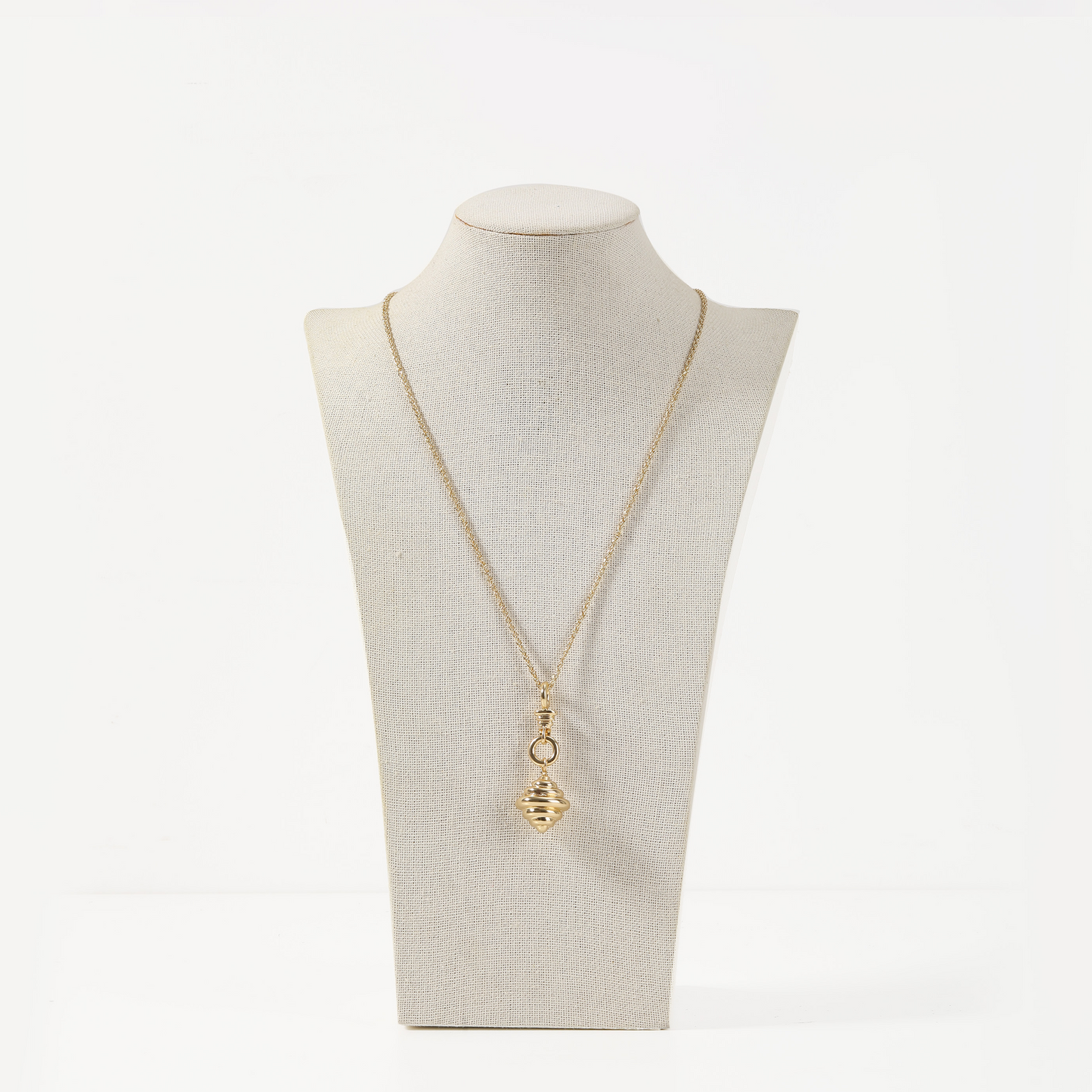 Gold necklace with ribbed spiral pendant