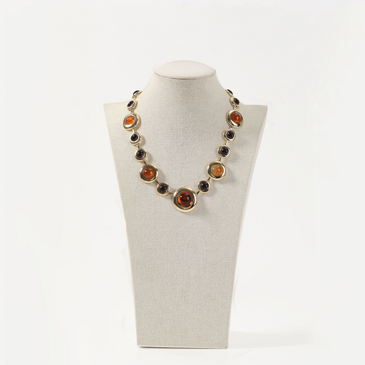 Gold statement necklace with amber-toned round gemstones