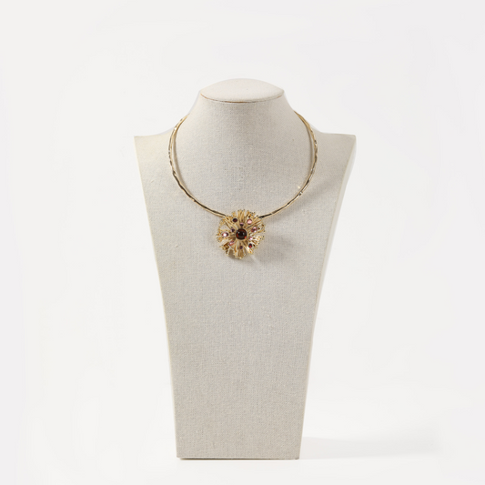 Gold torque necklace with sunburst multi-tone gemstone pendant