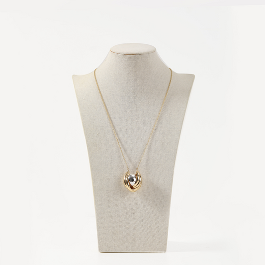 Gold twisted knot pendant necklace with silver accent