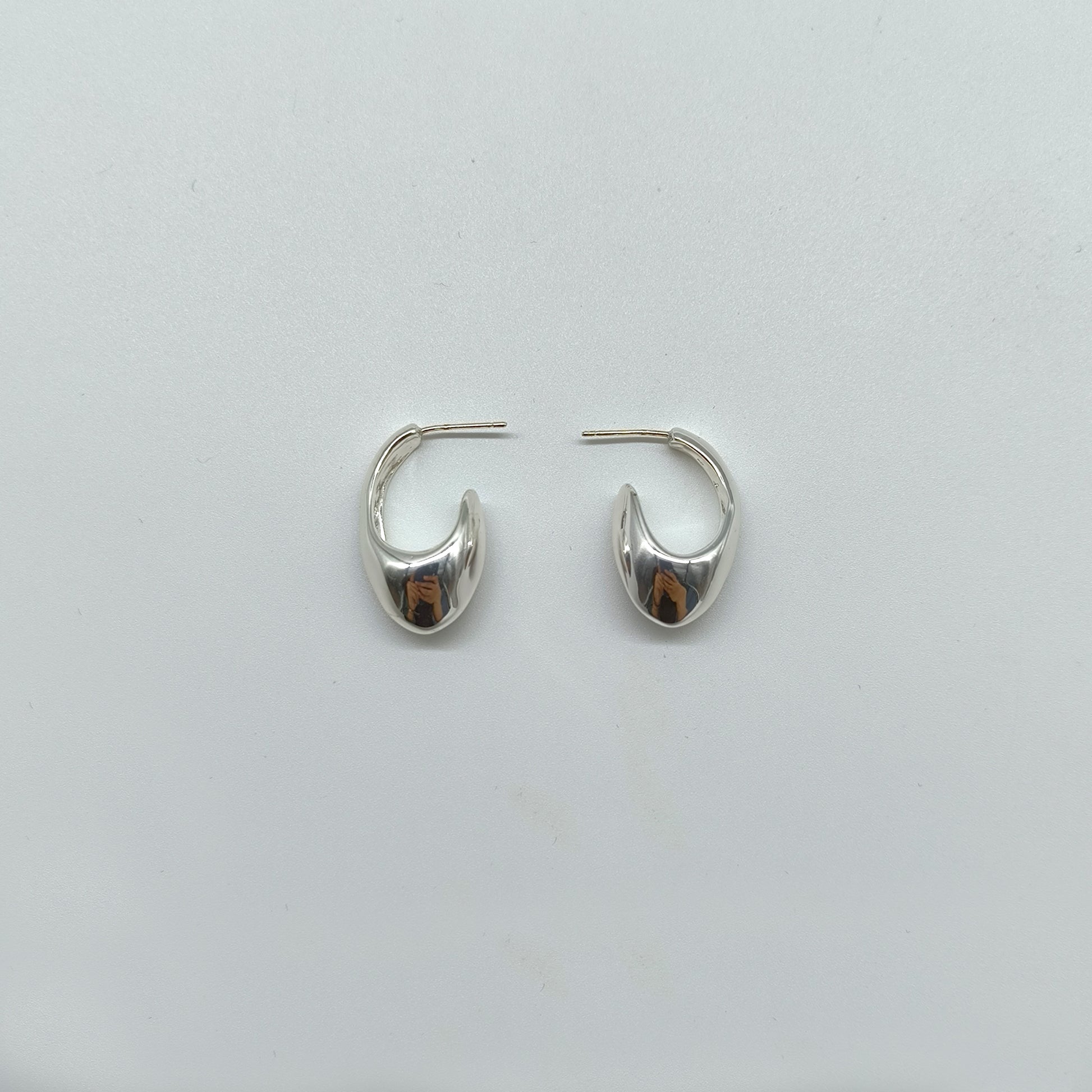 Chunky Silver Hoop Earrings with Organic Curve – Modern Statement Style