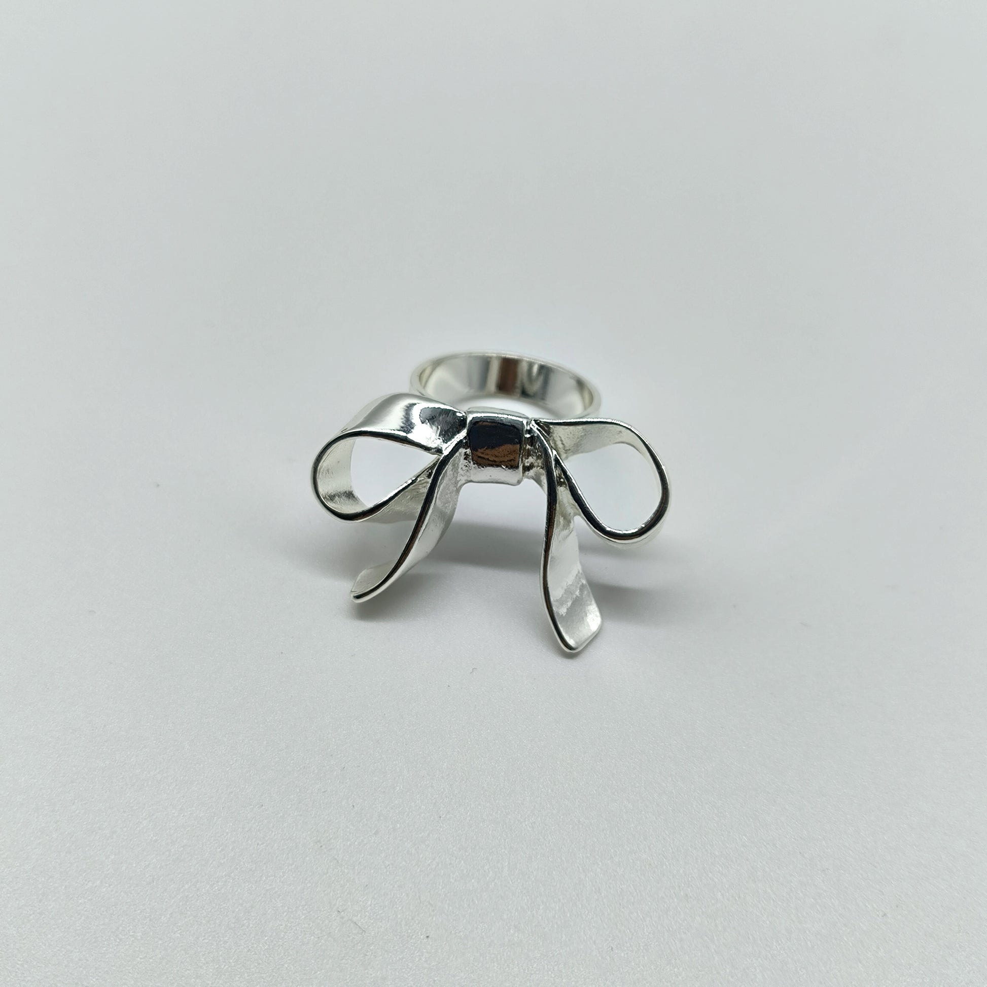 Statement Bow Ring – Shiny Silver Ribbon-Inspired Jewelry