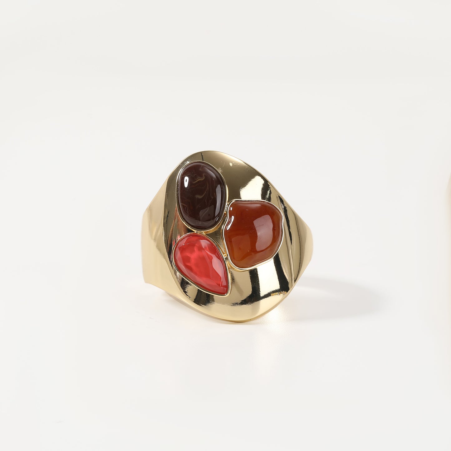 Gold statement bracelet with tri-color agate cabochons